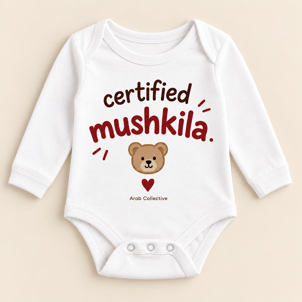 "CERTIFIED MUSHKILA" NEWBORN ONESIE LONG SLEEVE