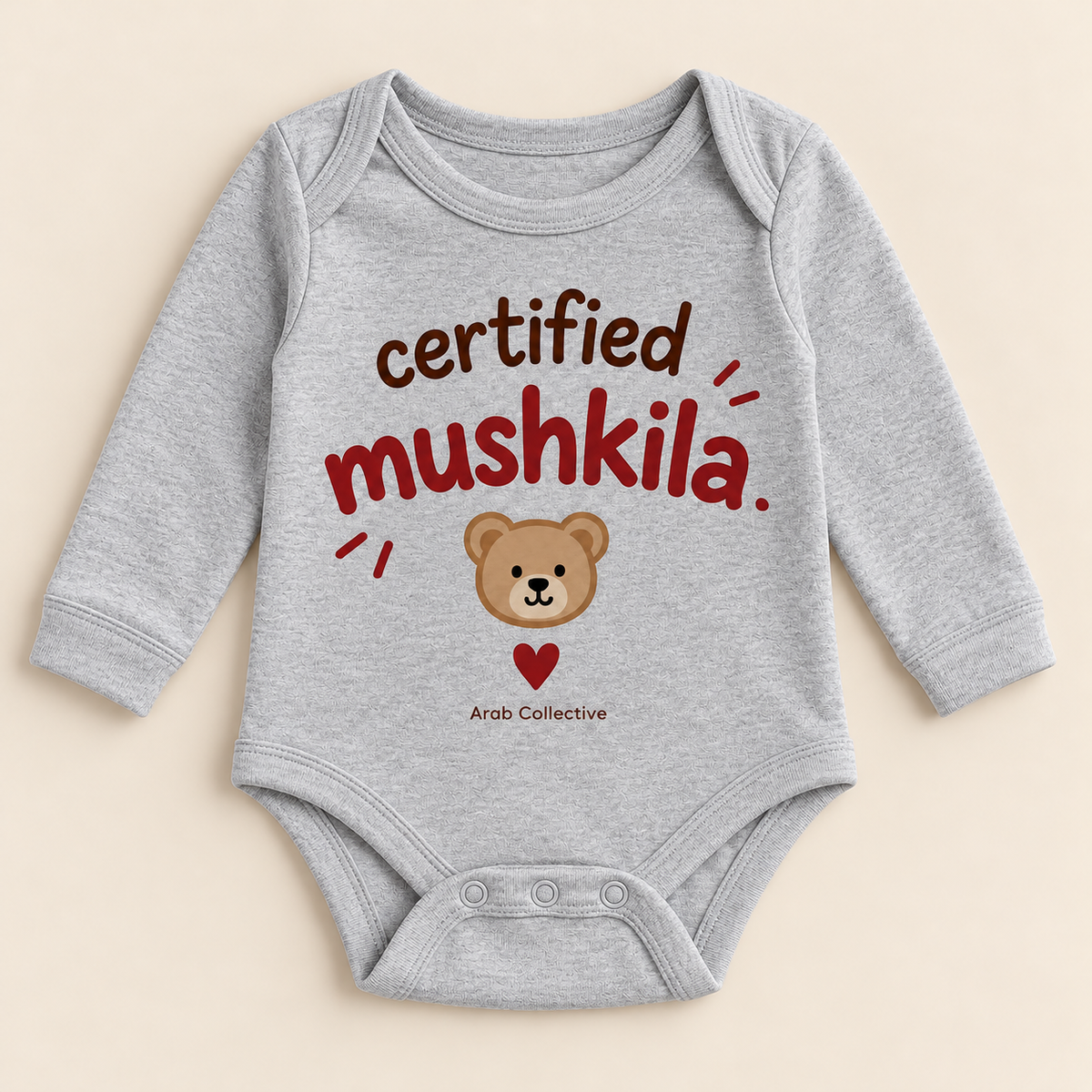 "CERTIFIED MUSHKILA" NEWBORN ONESIE LONG SLEEVE