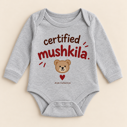 "CERTIFIED MUSHKILA" NEWBORN ONESIE LONG SLEEVE