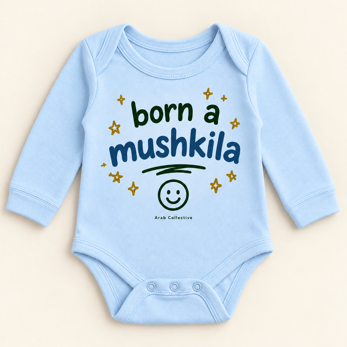 "BORN A MUSHKILA" NEWBORN ONESIE LONG SLEEVE