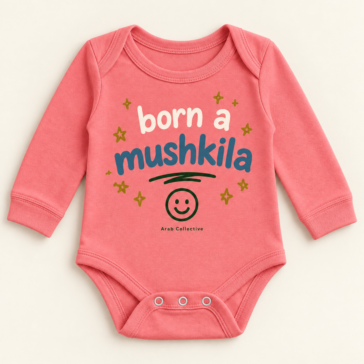 "BORN A MUSHKILA" NEWBORN ONESIE LONG SLEEVE